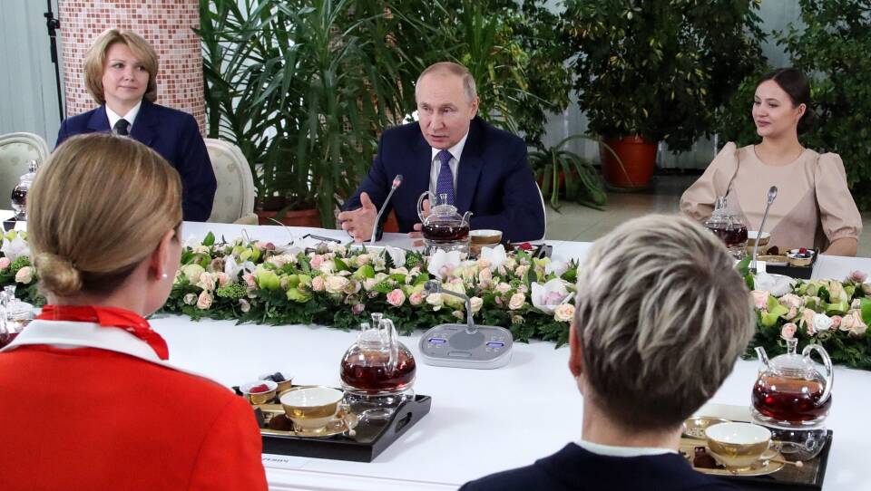 Russian President Vladimir Putin, center, issued strong words over the West's sanctions against his country as it continues its invasion of Ukraine. The remarks were issued during a meeting Saturday with employees of national airline Aeroflot.