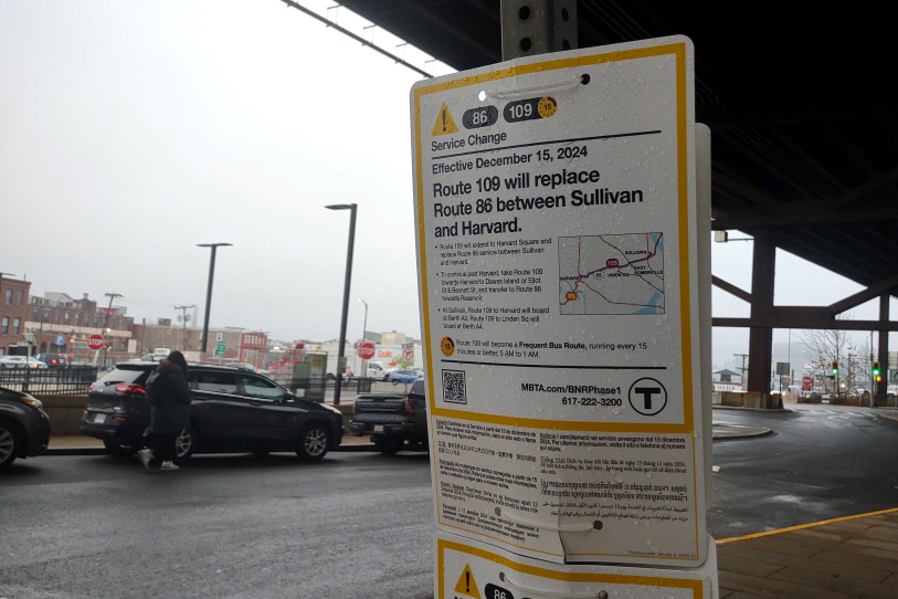 A metal sign warns that the route 86 bus will no longer have service between Sullivan and Harvard. Riders should now take route 109.