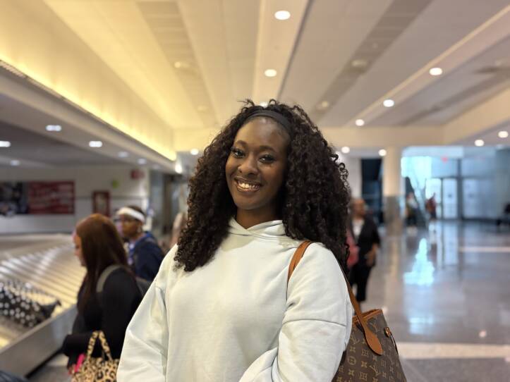 A woman stands in an airport