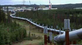 The Biden administration is announcing new and proposed regulations to limit climate-warming methane emissions from oil and gas operations and pipelines. This undated file photo shows the Trans-Alaska pipeline and pump station north of Fairbanks.