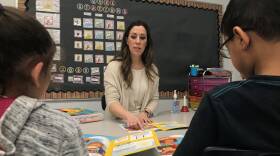 Erica Bono teaches a small group of kindergarteners to read at the Lafayette K-8 School in Everett.