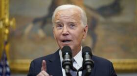 The president speaks from a podium