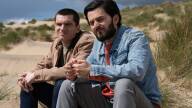 Sam (David Witts) and Asif Syed (Elham Ehsas) sit on the beach