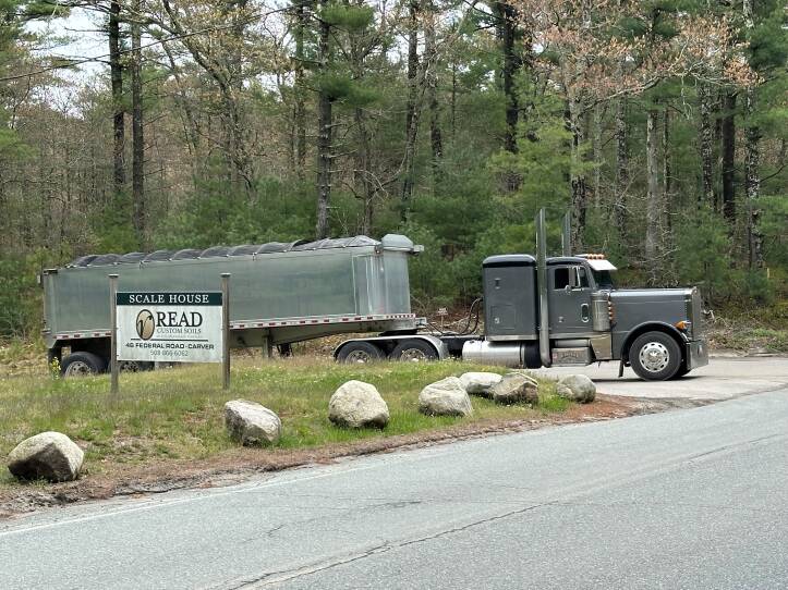 A truck pulls out onto a road.