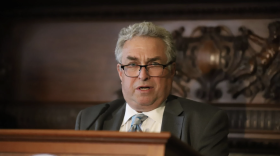 Rep. Ken Gordon speaks at a podium.