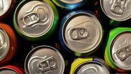 The tops of many soda cans