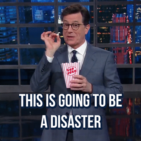 A man says "This is going to be a disaster." and eats popcorn