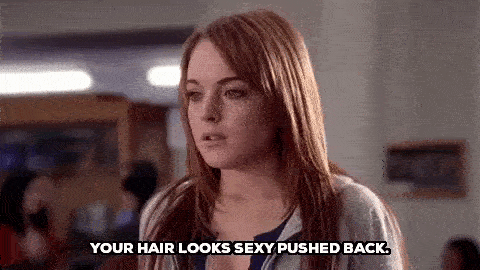 A woman reluctantly says "your hair looks sexy pushed back."