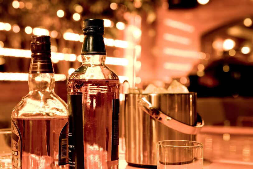 Whiskey Bottles on a Bar Top