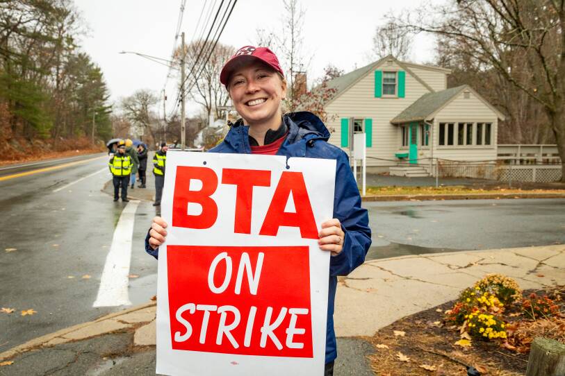 Beverly teacher Katie Walter-Jeffery holding a sign that says: BTA on strike