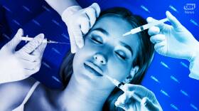 Several gloved hands with syringes point toward the face of a young woman with eyes closed and a serene face.