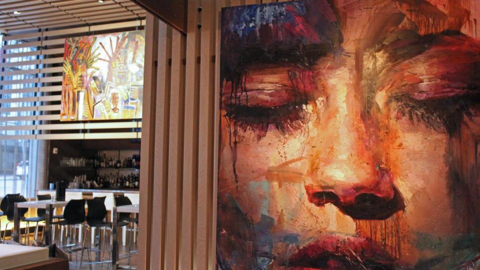 In the foreground, the painting is by Danielle Coenen. In back, over the bar, is work by Dante Latessa.