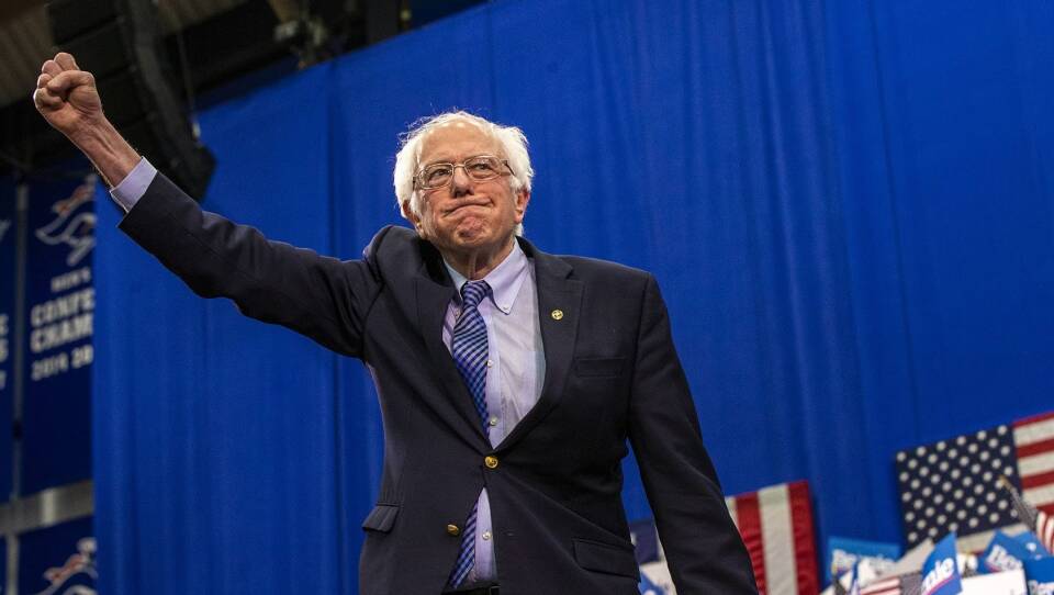 Presidential candidate Bernie Sanders raises his fist in victory in the New Hampshire Primary.