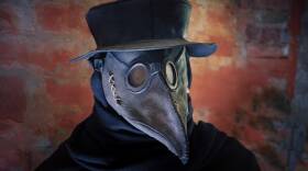 Plague mask, hat and costume of medieval Doctor.