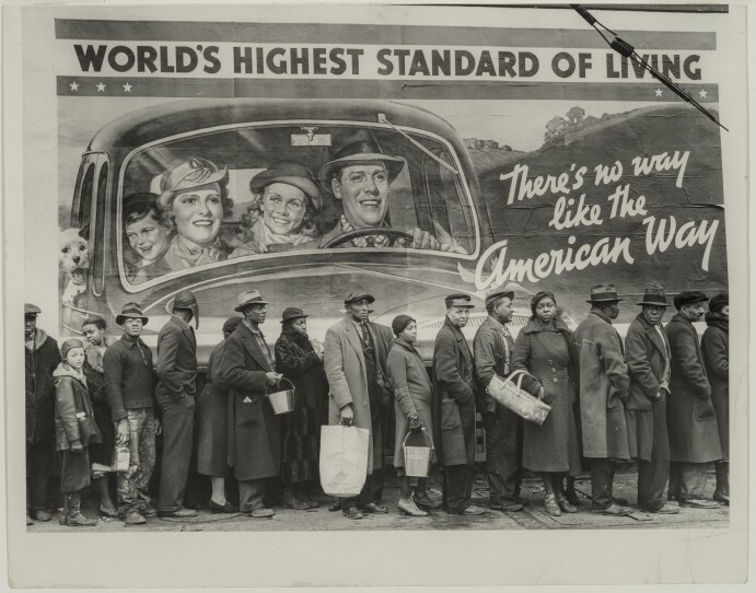 "At the Time of the Louisville Flood," a 1937 black and white photograph by Margaret Bourke-White, shows people waiting in line in front of a billboard ad that reads "World's Highest Standard of Living: There's no way like the American Way"