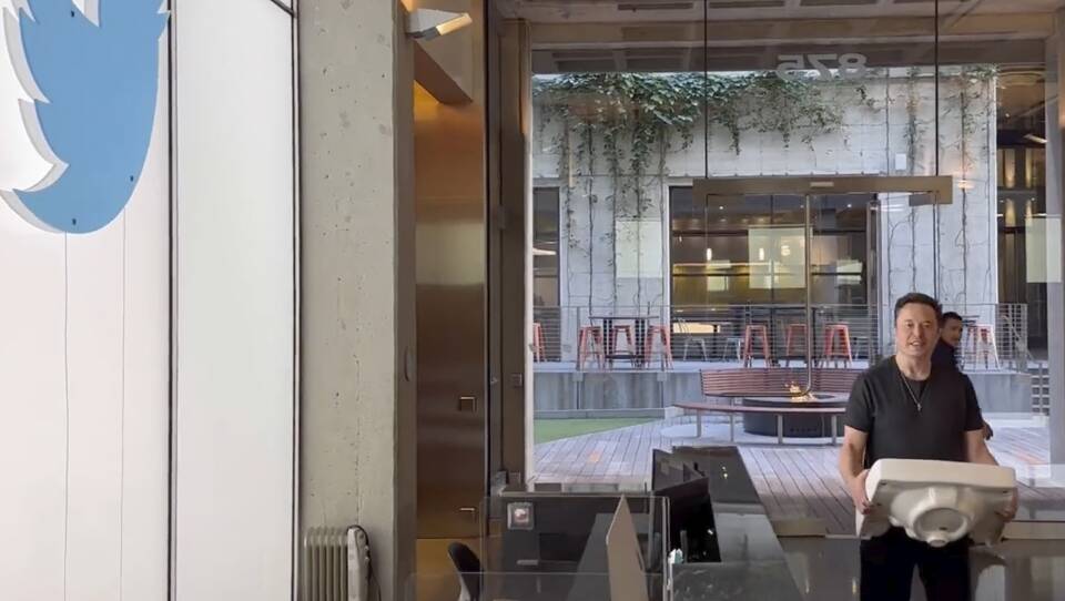 This image from the Twitter page of Elon Musk shows Musk entering Twitter headquarters carrying a sink through the lobby area on Wednesday, Oct. 26, 2022 in San Francisco.