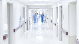 Doctors walking down hospital corridor