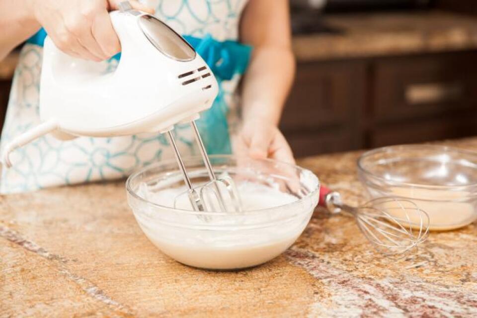 Whipping up a bowl of cream cheese frosting.