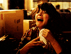 A woman cries uncontrollably