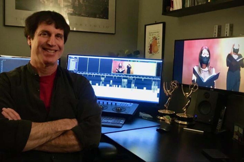 Production Group Blog3: Editor Arnie Harchik sits in front of his editing station