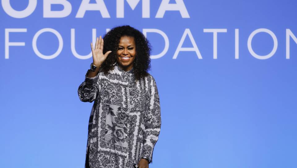 Former U.S. fist lady Michelle Obama waves as she attends an event for Obama Foundation in Kuala Lumpur, Malaysia, Thursday, Dec. 12, 2019. Obama and actress Julia Roberts attended the inaugural Gathering of Rising Leaders in the Asia Pacific organized by the Obama Foundation. (AP Photo/Vincent Thian)