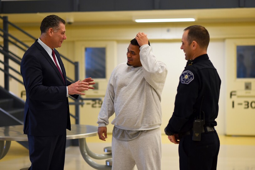 Middlesex County Sheriff Peter Koutoujian, inmate Eric Darden and Corrections Officer Stephen Hall.