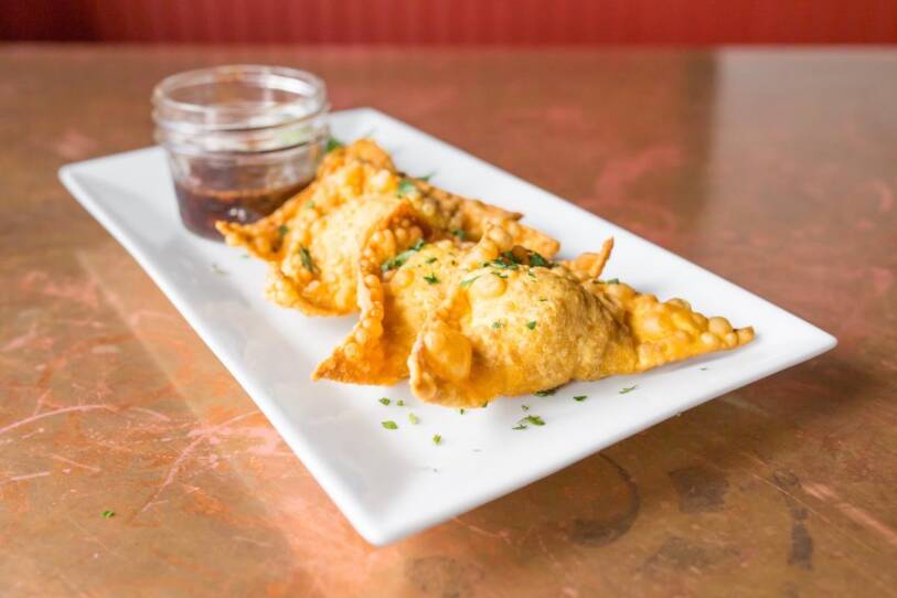The crispy crab rangoons, stuffed with pork belly and goat cheese.