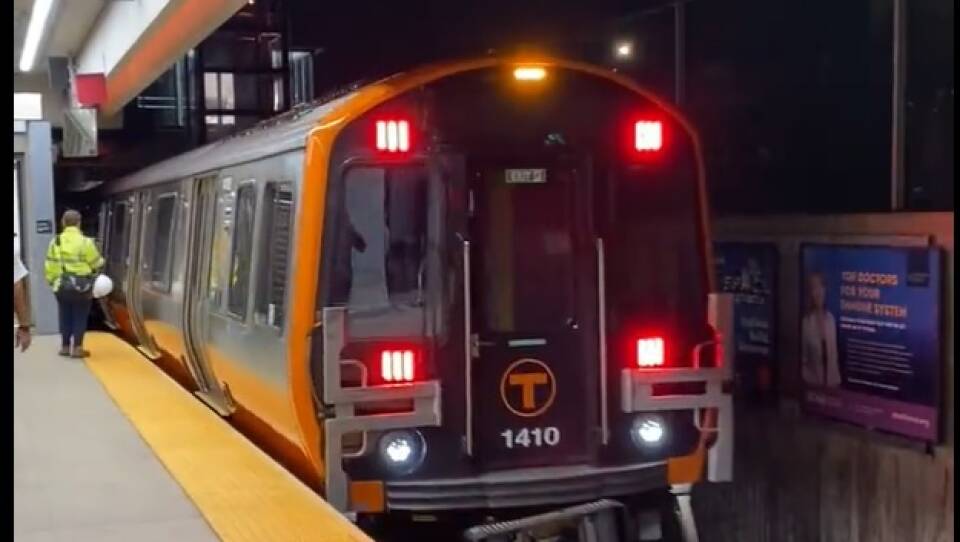 A new MBTA Orange Line train pulls into a station