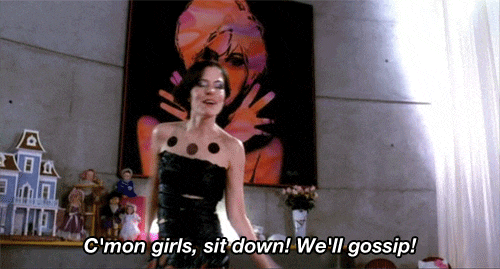 A woman says "C'mon girls, sit down! We'll gossip!"