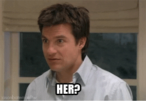 A man, very nonplussed, asks "Her?"