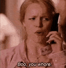 A woman rudely says "Boo, you whore."
