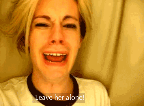 A weeping man shrieks "leave her alone!"