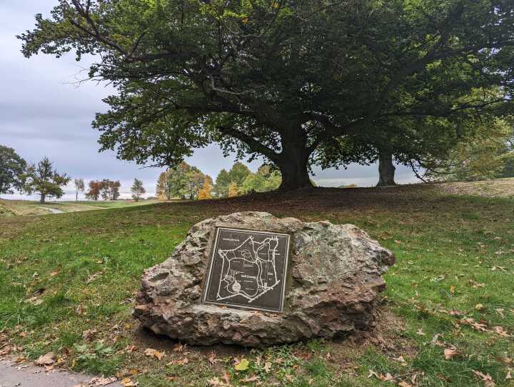 A large rock with a map engraved into it.