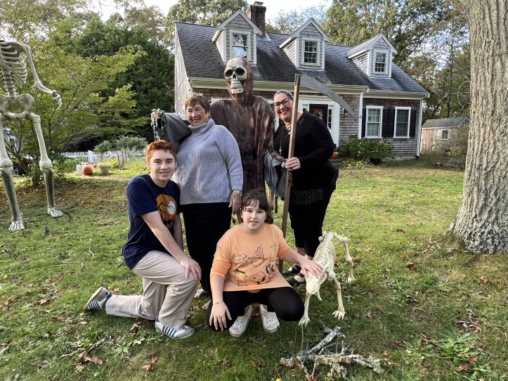 A larger-than-life Halloween display created by the Monac family decorates their front lawn on Route 6A in Dennis. Pictured are Coleman Monac, 16, Elizabeth Monac, 10, and Jennifer McNally Monac (right), with Jennifer's mother, Ann McNally.