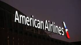 The American Airlines logo is seen atop the American Airlines Center in Dallas. (Michael Ainsworth/AP)