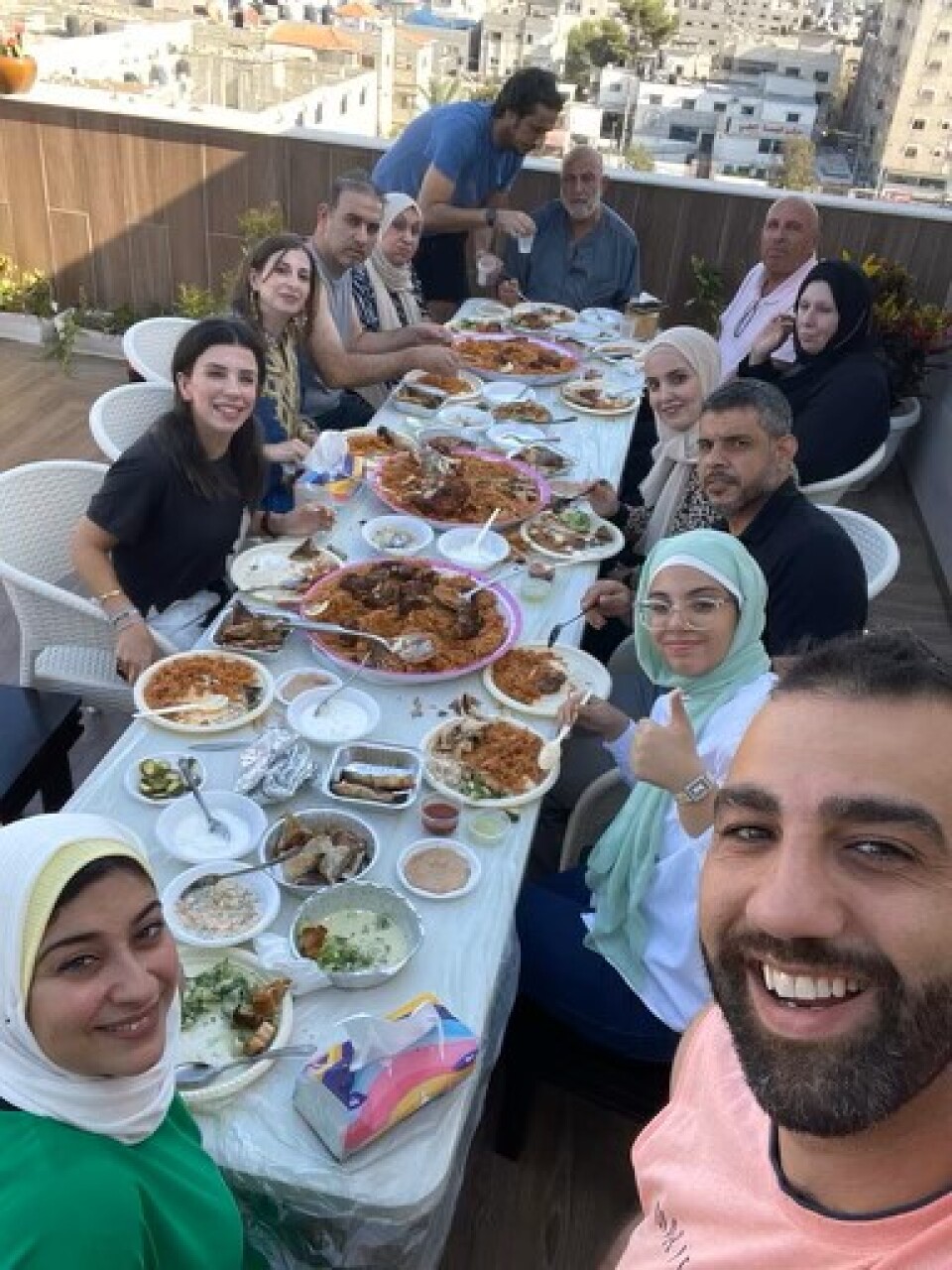 Abood Okal poses with family members in Gaza earlier this month.