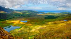 Sunny mountain and lake landscape on Dingle peninsula, Ireland
