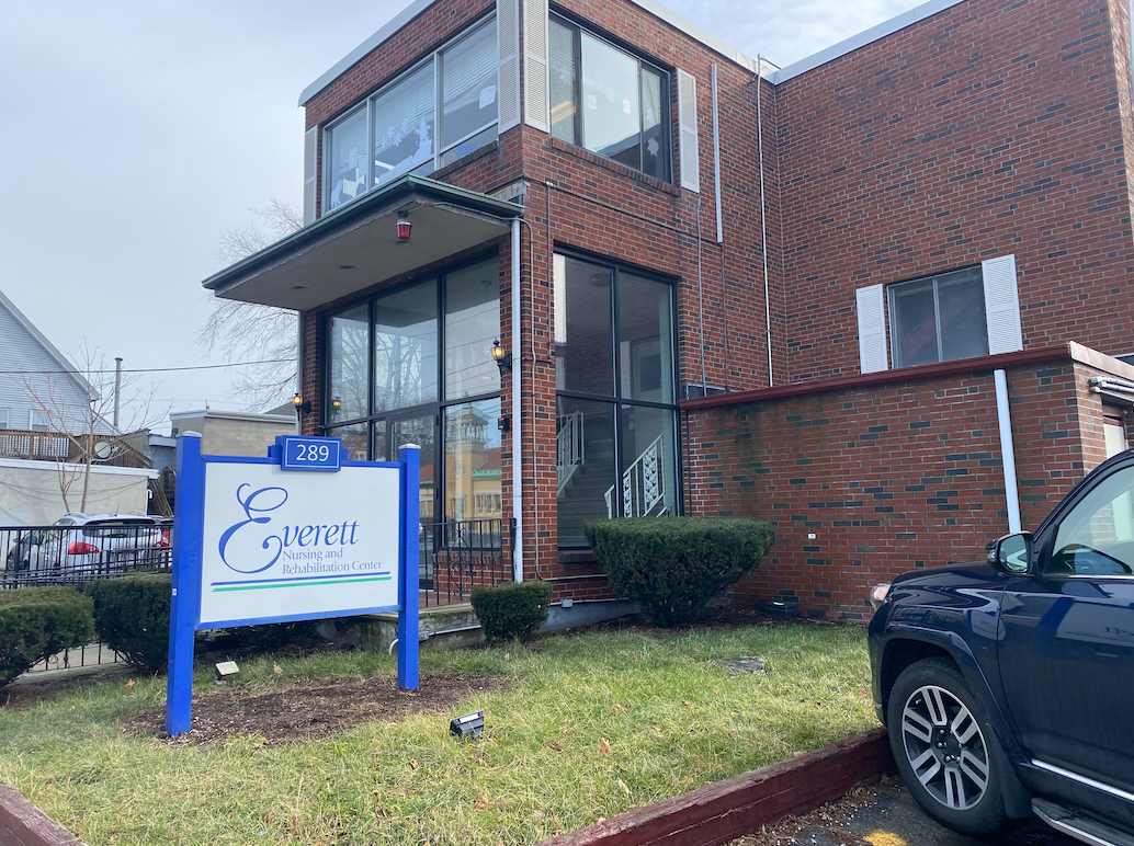 A sign outside of a brick building says 'Everett Nursing and Rehabilitation Center.'