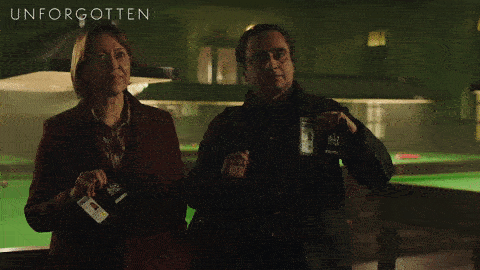 The detectives from the show Unforgotten show their badges.