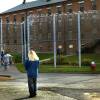 Incarcerated women walk from a courtyard back toward the Framingham prison.