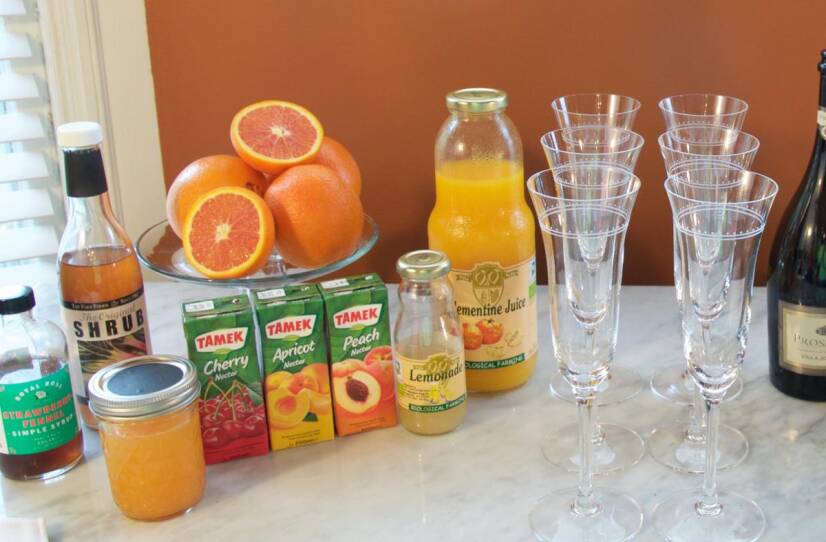 A variety of fruit juices and flavored syrups at the DIY Mimosa Bar.