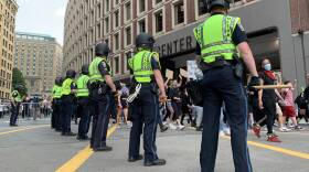 Police Officers outside a protest for police reform in Boston over the summer