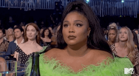 Lizzo shrugs