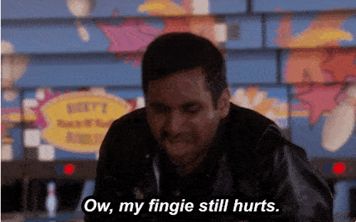 A man clutches his hand and says "Ow, my fingie still hurts."
