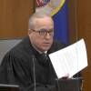 In an image taken from video on Monday, Hennepin County Judge Peter Cahill reads instructions to the jury before closing arguments in the trial of former Minneapolis police officer Derek Chauvin.