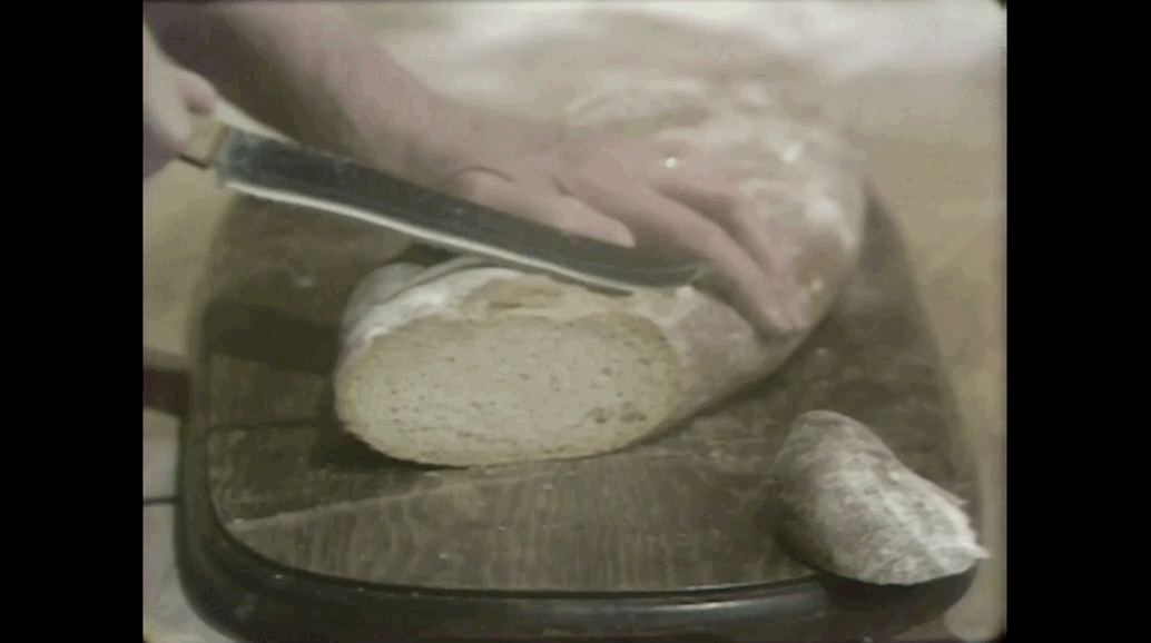 Julia slicing the finished rye bread.gif