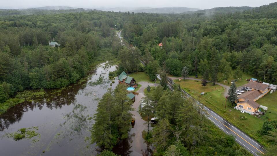An aerial view of a flooded backyard.