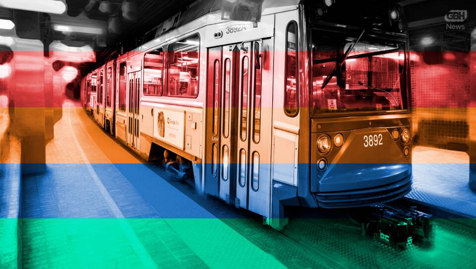 A Green Line MBTA train at Park Street station with the colors of the T overlaid in stripes on top of it. From the top: silver, red, orange, blue and green.