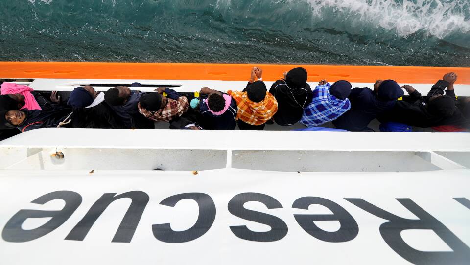 Migrants wait to disembark from the rescue ship Aquarius in the Sicilian harbor of Catania, Italy, on May 27. This past weekend the ship picked up more migrants, but was turned away from ports in Sicily and the nearby country of Malta. Now it will head for Spain instead.