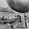 U.S., Blacks soldiers of an anti-aircraft unit moor a barrage balloon to a site on the coast of Normandy, Summer 1944.